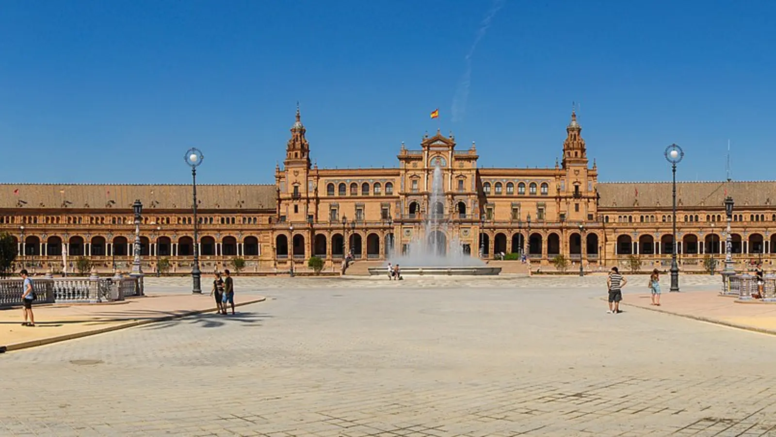 Plaza de España in Seville with tiled bridge, arcades, and open square